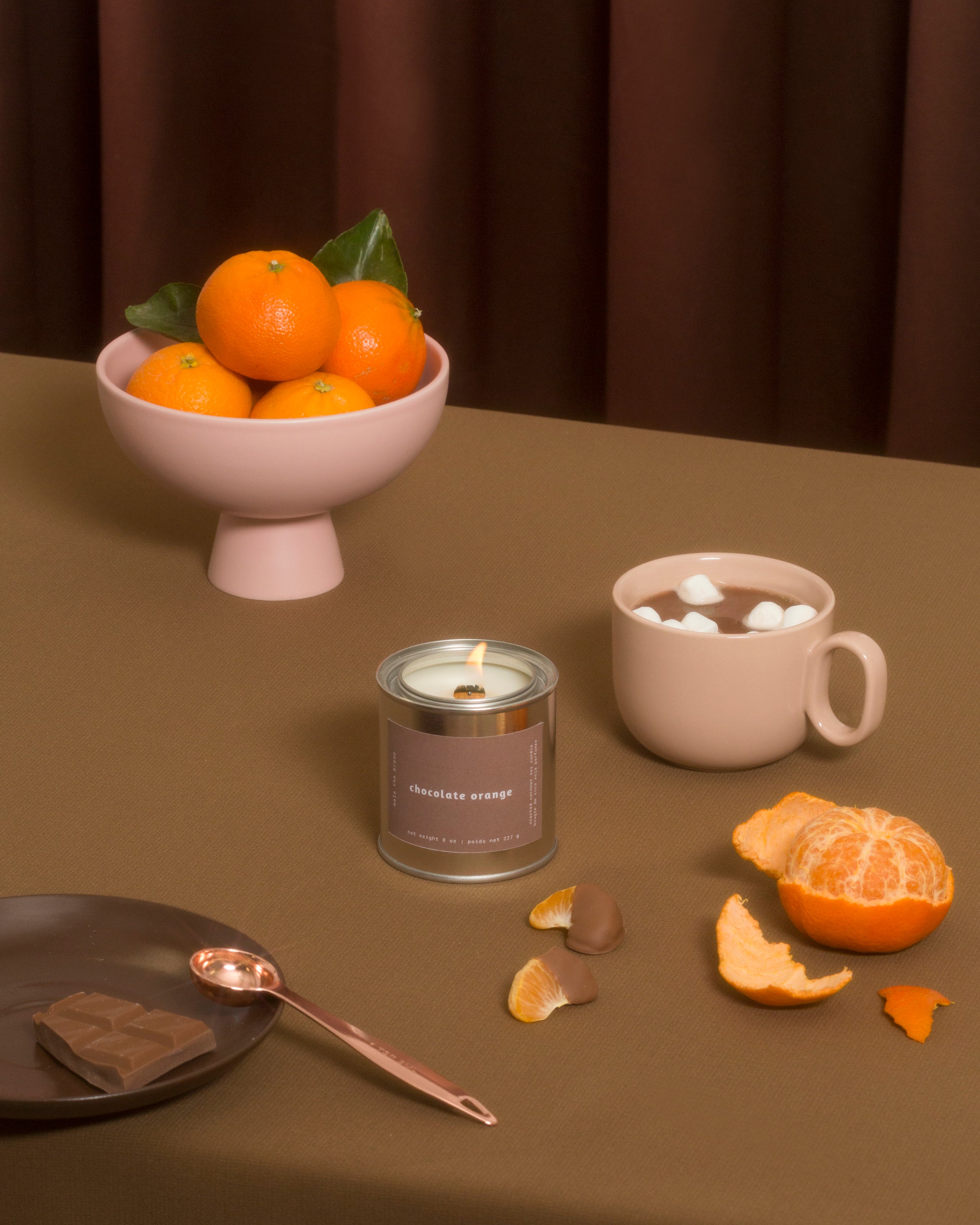 Chocolate Orange Candle the sill and soil